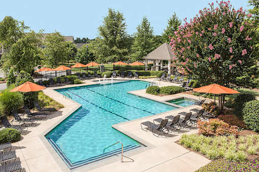 pool with sundeck with chairs