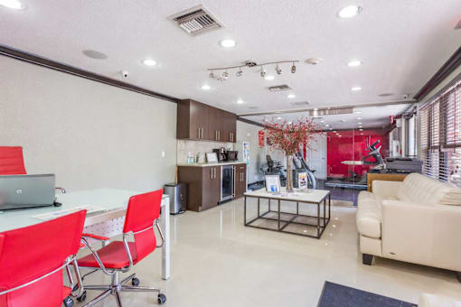 A modern living room with a dining table and chairs.