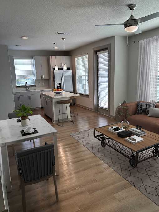 A modern living room with a dining table and a sofa.