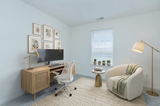 A room with a chair, desk, and a lamp.