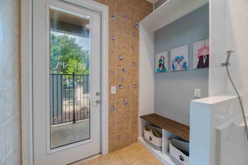 A bathroom with a window and a wall of decorative stickers.