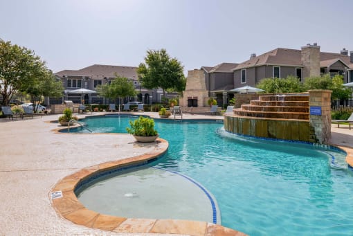 a large swimming pool with a house in the background at Orion Prosper Lakes, Prosper, TX, 75078
