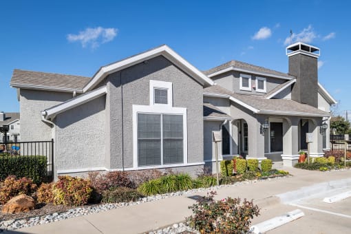a house with a yard and a sidewalk in front of it  at Orion Prosper, Prosper, Texas