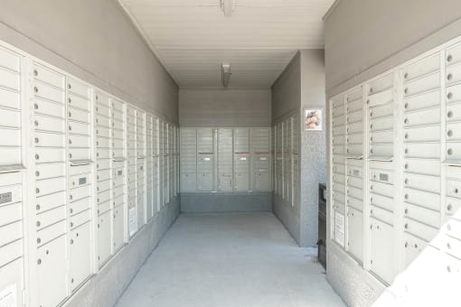 a long hallway with rows of lockers in a building at Orion Prosper, Prosper, TX, 75078