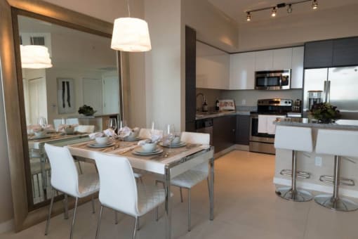 a dining room and kitchen with a table and chairs at Regatta at New River, Fort Lauderdale, 33301 at Regatta at New River, Fort Lauderdale Florida