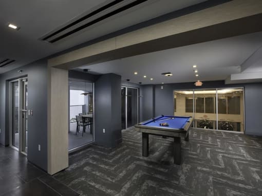 a spacious game room with a pool table and a bar at Saba Pompano Beach, Florida