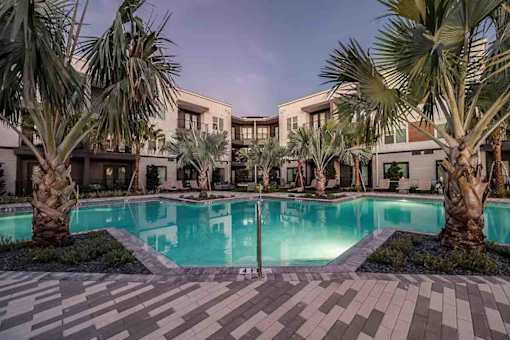 Resort-style swimming pool with lounge seating in Apollo Beach, and nearby areas