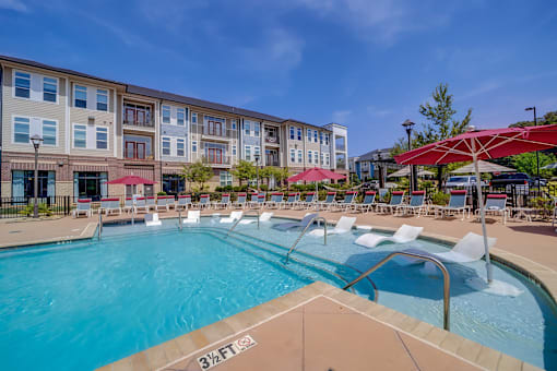 A large swimming pool with a 3 feet depth marking.