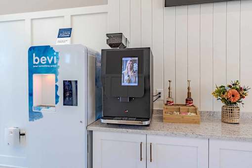 A fridge with a BevMo advertisement on it.