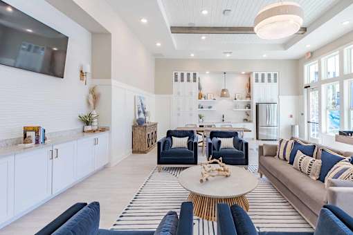 A living room with a white ceiling and a large window.