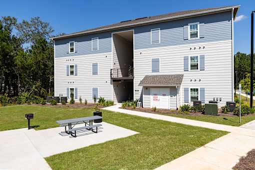 our apartments are equipped with a patio and a picnic table