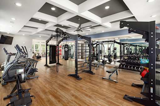 Luxury Apartments in Ridgeville, SC, with In-Unit Washer and Dryer - Preserve at Ridgeville - Fitness Center With Cardio Machines, Weight Racks, Strength Training Stations, And Mirrored Walls.