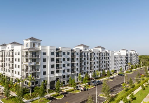an aerial view of a large apartment complex with a clear blue sky in the background at Leena Plantation, Florida, 33322