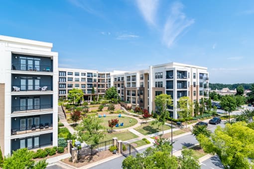 an aerial view of an urban park surrounded by apartment buildings