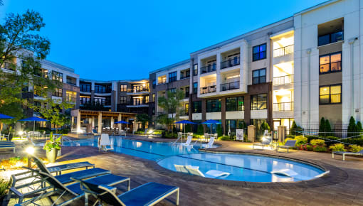 a rendering of a large building with a swimming pool
