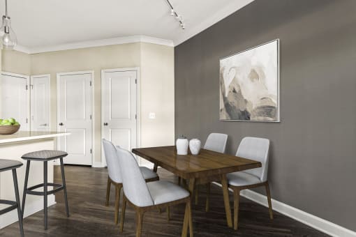 a dining room with a table and chairs