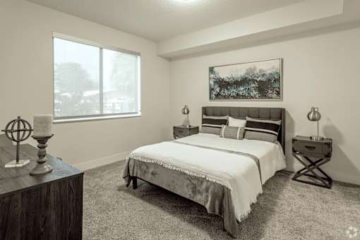 A bedroom with a large bed and a painting on the wall at Saba Pompano Beach, Pompano Beach, 33062