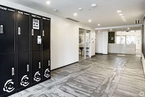 A row of black lockers with a white sign on the door at Saba Pompano Beach, Pompano Beach, 33062