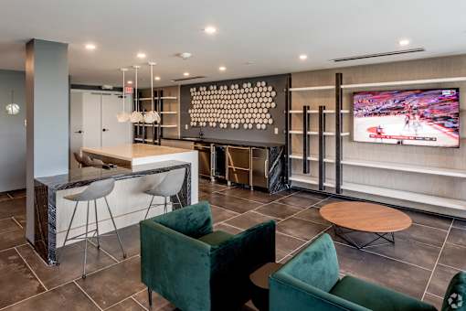 A modern living room with a television and comfortable seating at Saba Pompano Beach, Pompano Beach, 33062