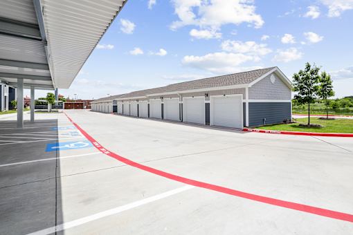 A parking lot with a red line painted on the pavement.