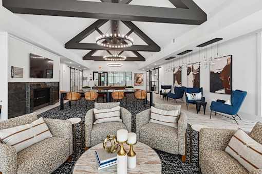 A living room with a fireplace and a chandelier.