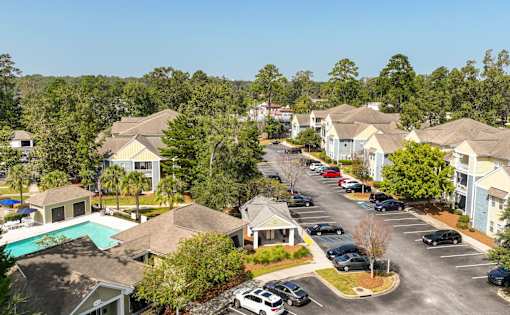 A view of a residential area with houses and cars.