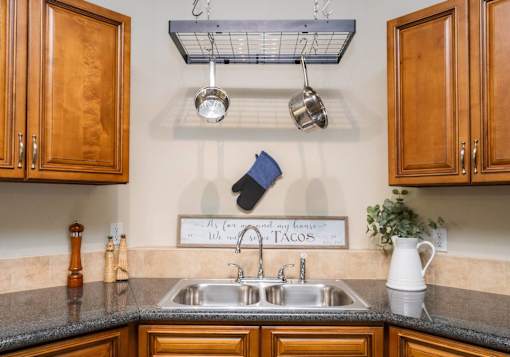 A kitchen with a sign that says "My corner and my tacos" above the sink.