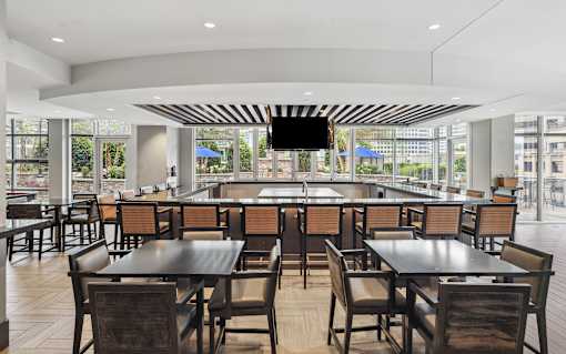 A large dining room with tables and chairs.