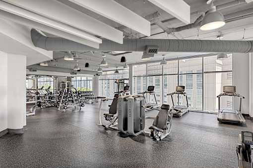 A gym with treadmills and exercise equipment.