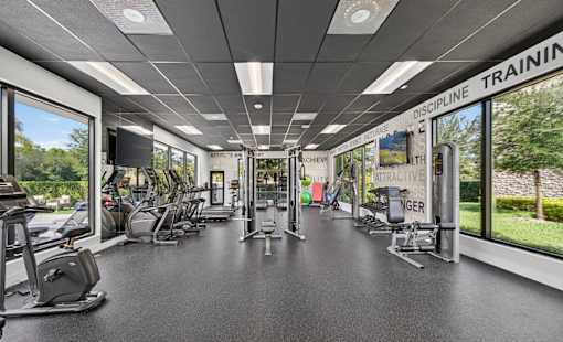 A gym with a sign that says "Discipline Training" on the wall.