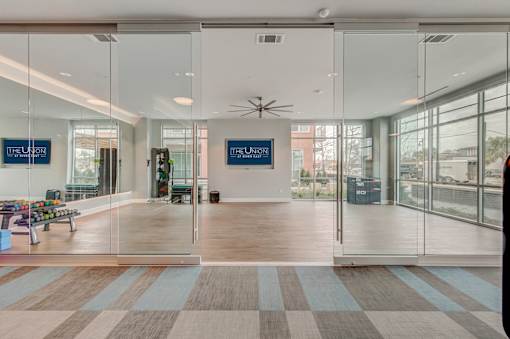 A glass wall with a sign that says "The Union" on it.