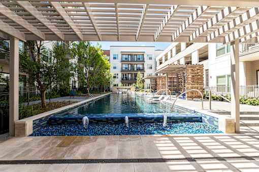 A long rectangular pool with a waterfall in the middle.