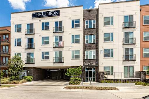 The Union apartment building with a parking lot in front.