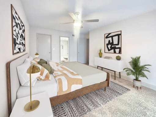 a bedroom with a large bed and a ceiling fan