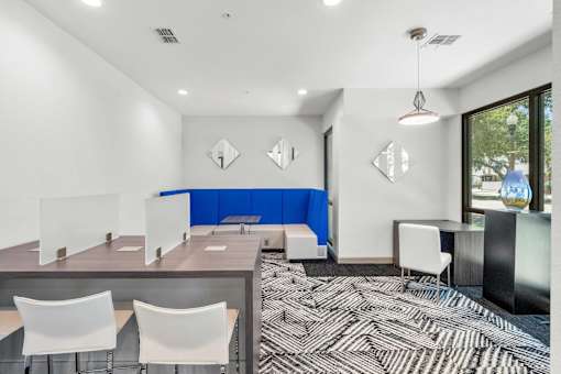 A conference room with a long table and chairs.