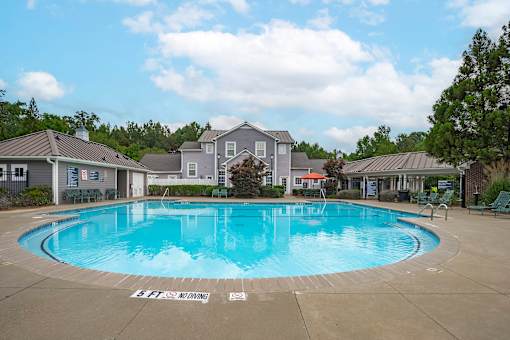 A large outdoor swimming pool with the words "Bank of America" on the ground.