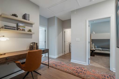 A room with a desk and a chair.
