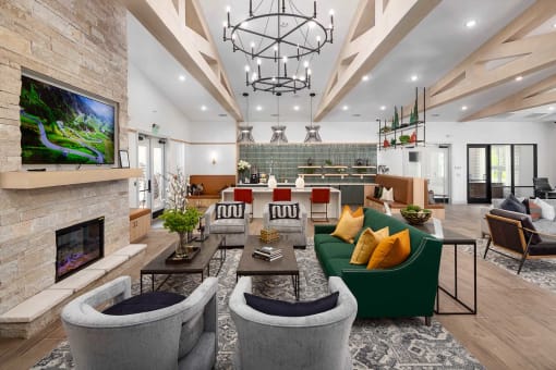 a living room with couches and chairs and a fireplace