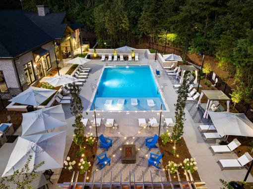 a view of the pool from a hotel at night