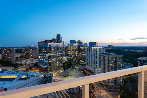 a city skyline at dusk from a high rise building