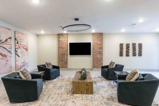a large living room with couches and a television