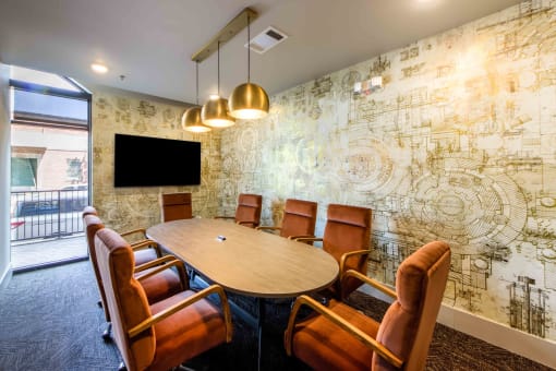 a conference room with a table and chairs