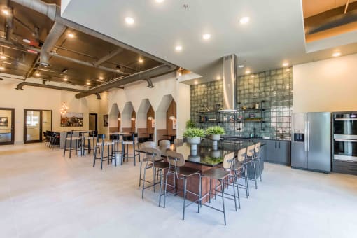the lobby of a restaurant with tables and chairs