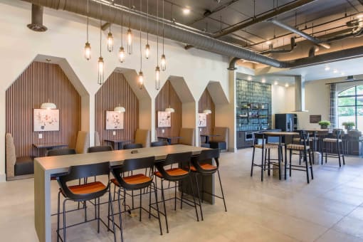 a restaurant with tables and chairs in a lobby