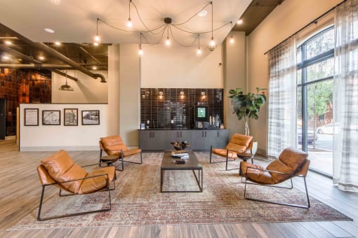 a lobby with leather chairs and a coffee table