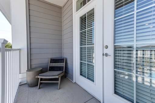 A white door with a window next to it.