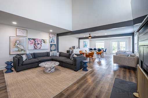 A living room with a grey sofa and a coffee table.