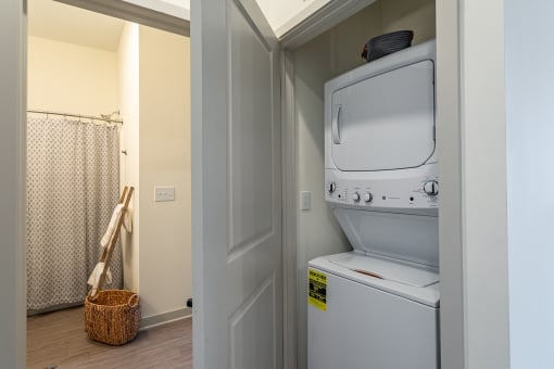 a small laundry room with a washer and dryer