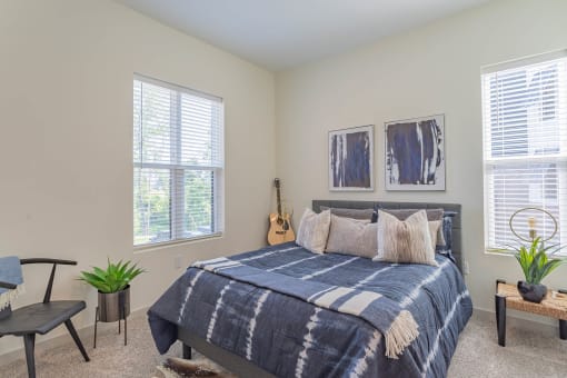 Apartments In Hermitage For Rent - Spacious Bedroom With High Ceiling, Plush Carpet Flooring, And Large Contemporary Windows With Blinds.