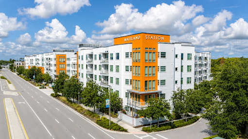 A multi-story building with a bright orange and white facade is labeled as "Matthiessen Station.".